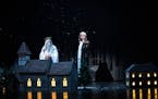 Kurt Kwan, left, is the Ghost of Christmas Past and Matthew Saldivar plays Scrooge in the 2023 production of “A Christmas Carol” at the Guthrie Th