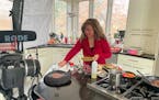 Amalia Moreno-Damgaard prepared a meal in her kitchen and studio in Eden Prairie. A media personality and caterer, she led the Minnesota chapter of th