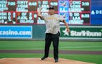 Frank White threw out the first pitch before a Twins game.