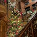 A tree that nearly reaches the second floor is among the holiday decorations at Glensheen.