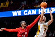 The Gophers’ Amaya Battle, who had 10 points and five assists, went up for a shot as Cal State Northridge’s Kayanna Spriggs defended Wednesday nig