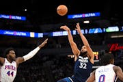 The Wolves’ Karl-Anthony Towns shot over the 76ers’ Paul Reed during the first quarter Wednesday night at Target Center.