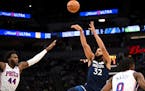 The Wolves’ Karl-Anthony Towns shot over the 76ers’ Paul Reed during the first quarter Wednesday night at Target Center.