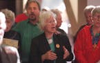 Sister Rita McDonald singing with other protesters at the Hennepin County Government Center in 1997, after 78 land-mine protesters were found guilty o