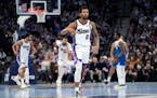 Kings guard Malik Monk gestured after making a 3-point basket during the first half Friday against the Wolves.