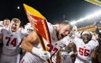 Wisconsin tight end Hayden Rucci (87) chops a goalpost with Paul Bunyan’s Axe after defeating Minnesota 28-14 Saturday, Nov. 25, 2023, at Huntington