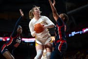 Gophers center Sophie Hart (52) prepared to put up a shot against Stony Brook on Sunday at Williams Arena. Hart scored 17 points on 8-for-13 shooting.
