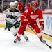 Red Wings center Andrew Copp was pursued by Wild forward Ryan Hartman on Sunday in Detroit.