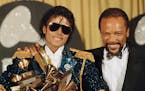 Michael Jackson and Quincy Jones celebrated their big haul at the 1984 Grammys.