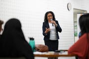 Sonia Stewart responded to a question posed by student representative Halimah Abdullah, left, at the meet-and-greet preceding her interview with Minne