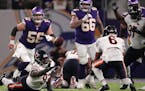 Chicago Bears defensive tackle Justin Jones (93) reaches for a loose ball as Chicago Bears cornerback Kyler Gordon (6) makes the interception in the f