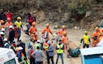 Rescuers work at the site of an under-construction road tunnel that collapsed in Silkyara in the northern Indian state of Uttarakhand, India, Tuesday,