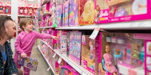 Nevin Kennedy looked at Barbie dolls on Nov. 21 at Target in Edina with his daughter Luna, 4. Son Bart, 6 months, isn’t pictured.