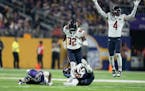 Bears safety Jaquan Brisker (9) intercepted a pass that bounced off the hands of Vikings wide receiver Jordan Addison (3) in the second quarter Monday