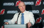 FILE - In this Monday, Oct. 14, 2019 file photo, New Jersey Devils head coach John Hynes talks to reporters after an NHL hockey game against the Flori