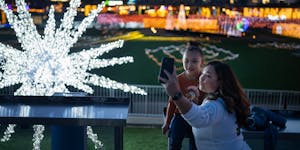 Ana Perez and her daughter Iivy Perez, 6, enjoyed the lights at the GLOW Holiday Festival at CHS Field in St. Paul.