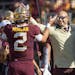 Tanner Morgan celebrates a touchdown pass with P.J. Fleck in 2022 in one of Morgan’s 33 wins as a starter under Fleck.