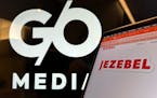Logos for G/O Media and Jezebel are displayed on monitors in New York on Nov. 10, 2023. 
