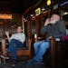 Friends Joe Blauert, left, of St. Paul, and Scott Johnson of Carver enjoy cigars in the smoking lounge at Anthony’s Pipe and Cigar Lounge in south M