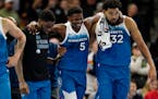 Timberwolves guard Anthony Edwards (5) was helped off the court after taking a fall on his right hip in the third quarter of Tuesday’s win against t