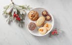 The winning cookies of the 2023 Star Tribune Holiday Cookie Contest. Center, Earl Grey Butter Cookies with Dark Chocolate and Orange Filling (the winn