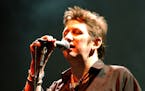 FILE - Shane McGowan performs live on stage at the Fleadh 2002 Music festival, Finsbury Park, North London, June 8, 2002. Macgowan, the singer-songwri