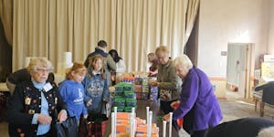 The congregation at Richfield United Methodist Church prepares housewarming gift baskets to welcome new neighbors to the former Metro Inn Hotel, a for
