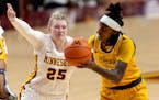Gophers freshman Grace Grocholski (25) defend against Norfolk State’s Danielle Robinson and finished with 26 points Wednesday at Williams Arena.