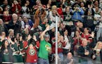 Minnesota Wild Fans celebrate an empty net goal in the third period Sunday, Nov. 7, 2021 at Xcel Energy Center in St. Paul, Minn. ] CARLOS GONZALEZ �