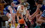 Gophers guard Mara Braun clamored over the ball during the second overtime against Drake on Saturday. 