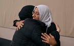 Two women hug as Muslim and Jewish women gather at an interfaith workshop on the Israeli-Palestinian conflict at Rutgers University on Sunday, Nov. 19