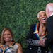 President Joe Biden gave 2023 Kennedy Center honoree Dionne Warwick a kiss during the Kennedy Center honorees reception in the East Room of the White 