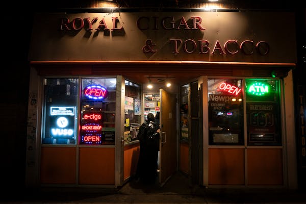 Royal Cigar & Tobacco customers walked into the Dinkytown store Sunday, hours after two people were shot and killed there, Minneapolis police said. 
