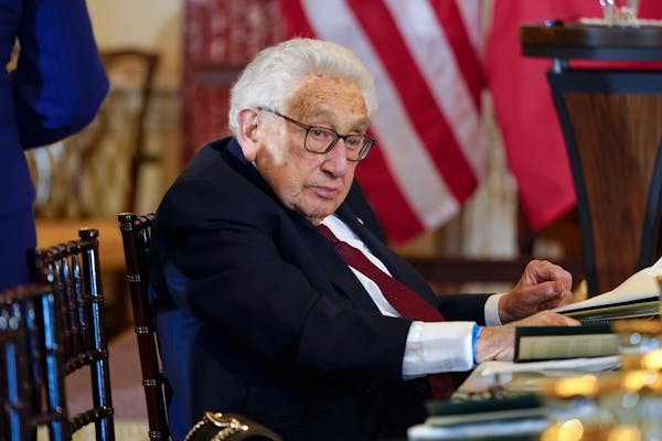 Former U.S. Secretary of State Henry Kissinger attends a luncheon with French President Emmanuel Macron, Vice President Kamala Harris and Secretary of