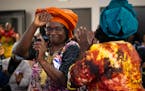 Jane Windsperger danced toward the podium after her introduction at the end-of-season harvest festival hosted by the Minnesota African Immigrant Farme