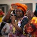 Jane Windsperger danced toward the podium after her introduction at the end-of-season harvest festival hosted by the Minnesota African Immigrant Farme