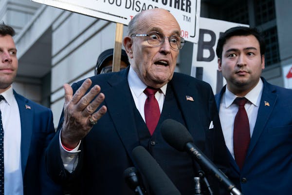 Rudy Giuliani blasts Joe Biden on his way out of court